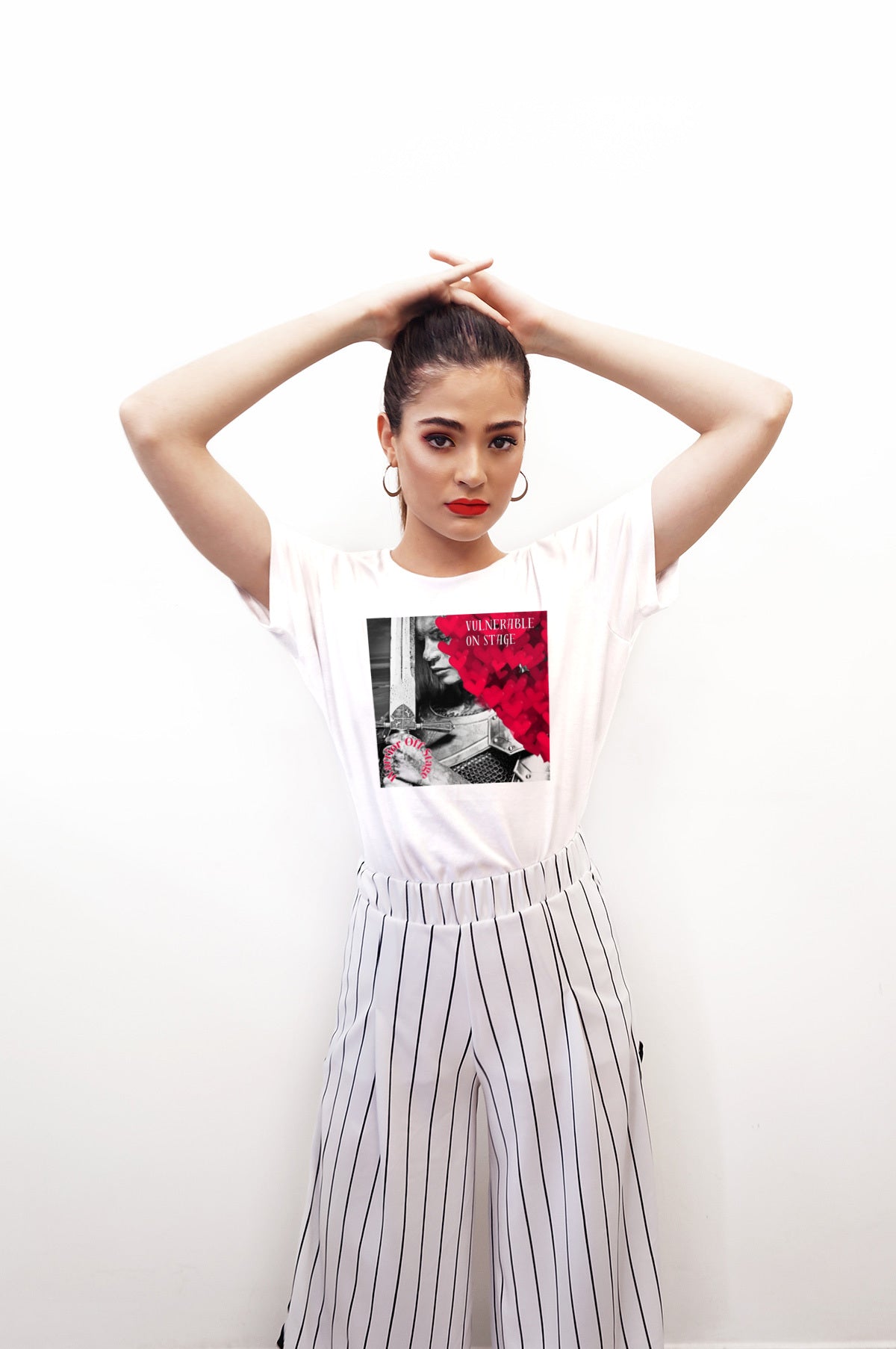 A bold and stylish Unisex Artist Vulnerable Warrior T-Shirt in Classic design, specifically crafted for Female Artists The shirt features empowering graphics, celebrating authenticity on stage and fierce warrior strength off stage. Perfect for making a statement in the world of art and beyond. White Tee Plus Sizes Available.