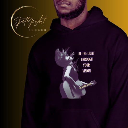 A stylish black and white Heavyweight Be the Light Unisex Hoodie displayed against a backdrop of creativity. The bold graphics symbolize authenticity, inviting artists to embrace their vision and be the light for their audience. - Color Black