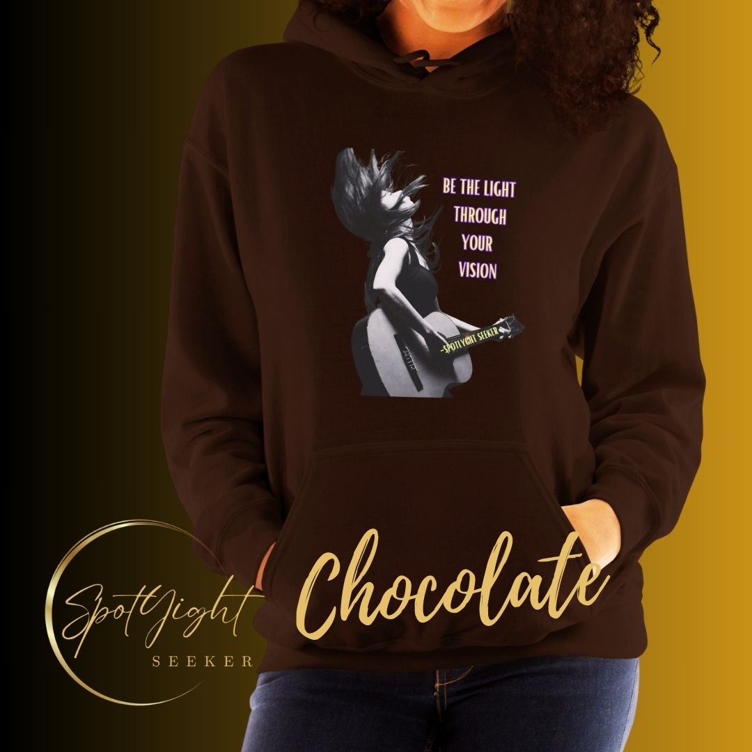 A stylish black and white Heavyweight Be the Light Unisex Hoodie displayed against a backdrop of creativity. The bold graphics symbolize authenticity, inviting artists to embrace their vision and be the light for their audience. - Chocolate Color