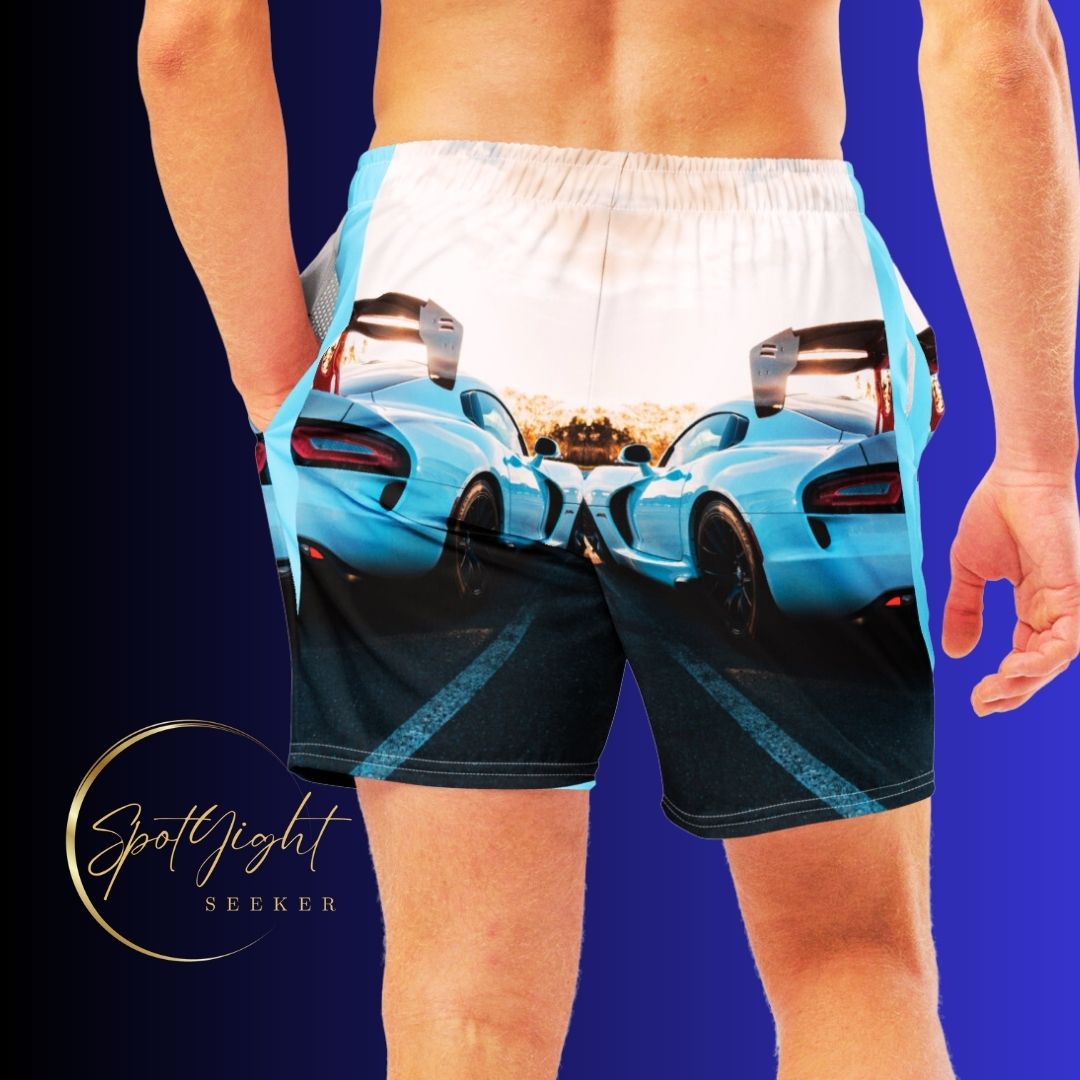 Male artist confidently stands out in vibrant race car swim trunks from SpotlYght Seeker, symbolizing success and creative expression. Skrrt your way to style and savings!