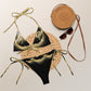 Black Rebel Artist Sting Bikini - A sleek black bikini with an intriguing design, embodying artistic mystery and allure.