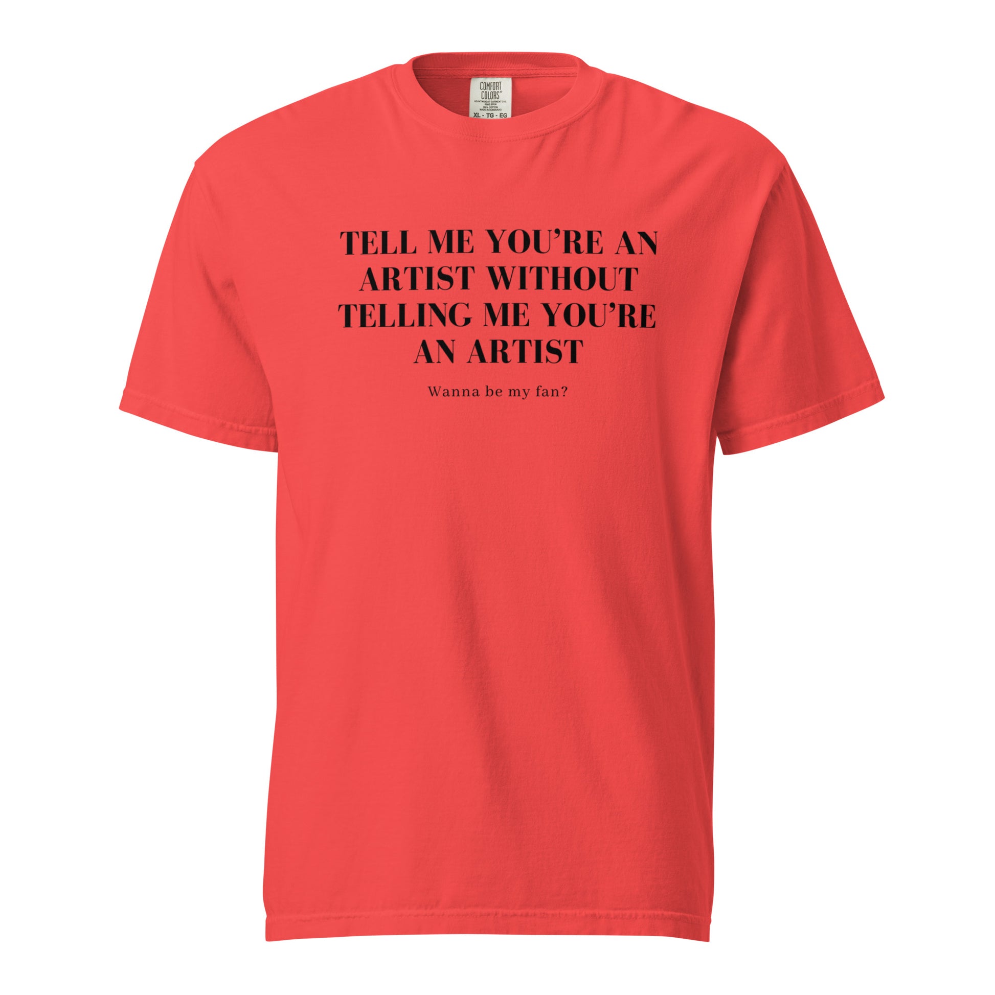 Image of the new meme tee from the Let 'Em Know Collection, featuring bold text that reads: 'Tell me you're an artist without telling me you're an artist. Wanna be my fan?' Plus, choose between plain and SpotlYght Seeker tags!